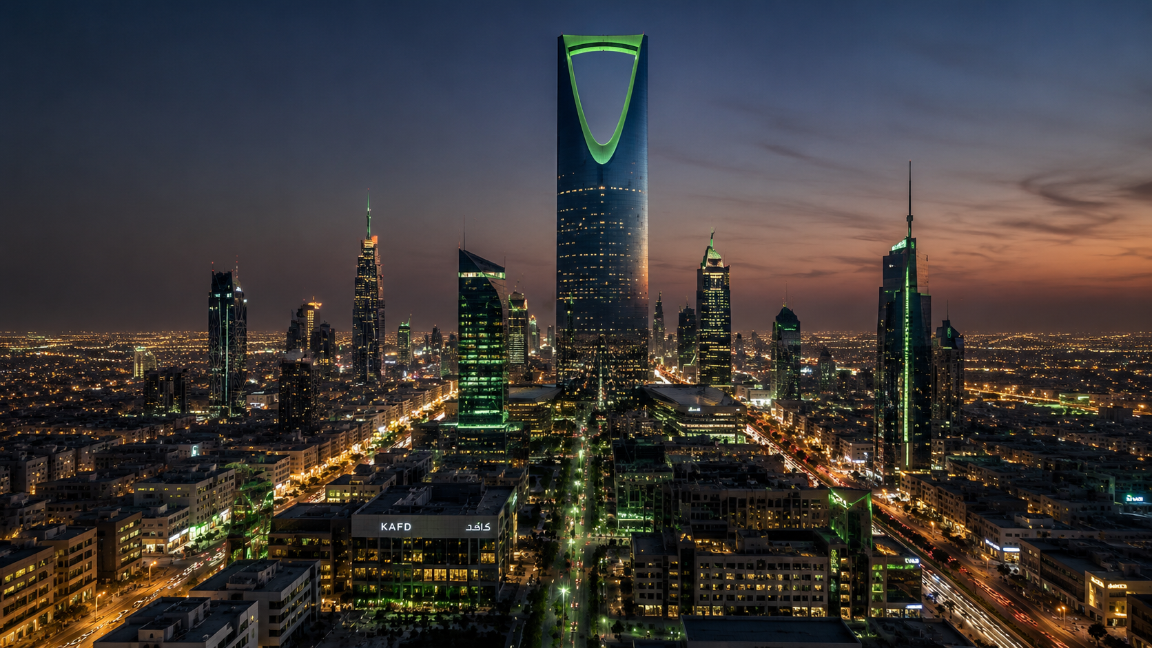 Riyadh skyline at dusk with Kingdom Centre Tower illuminated in green